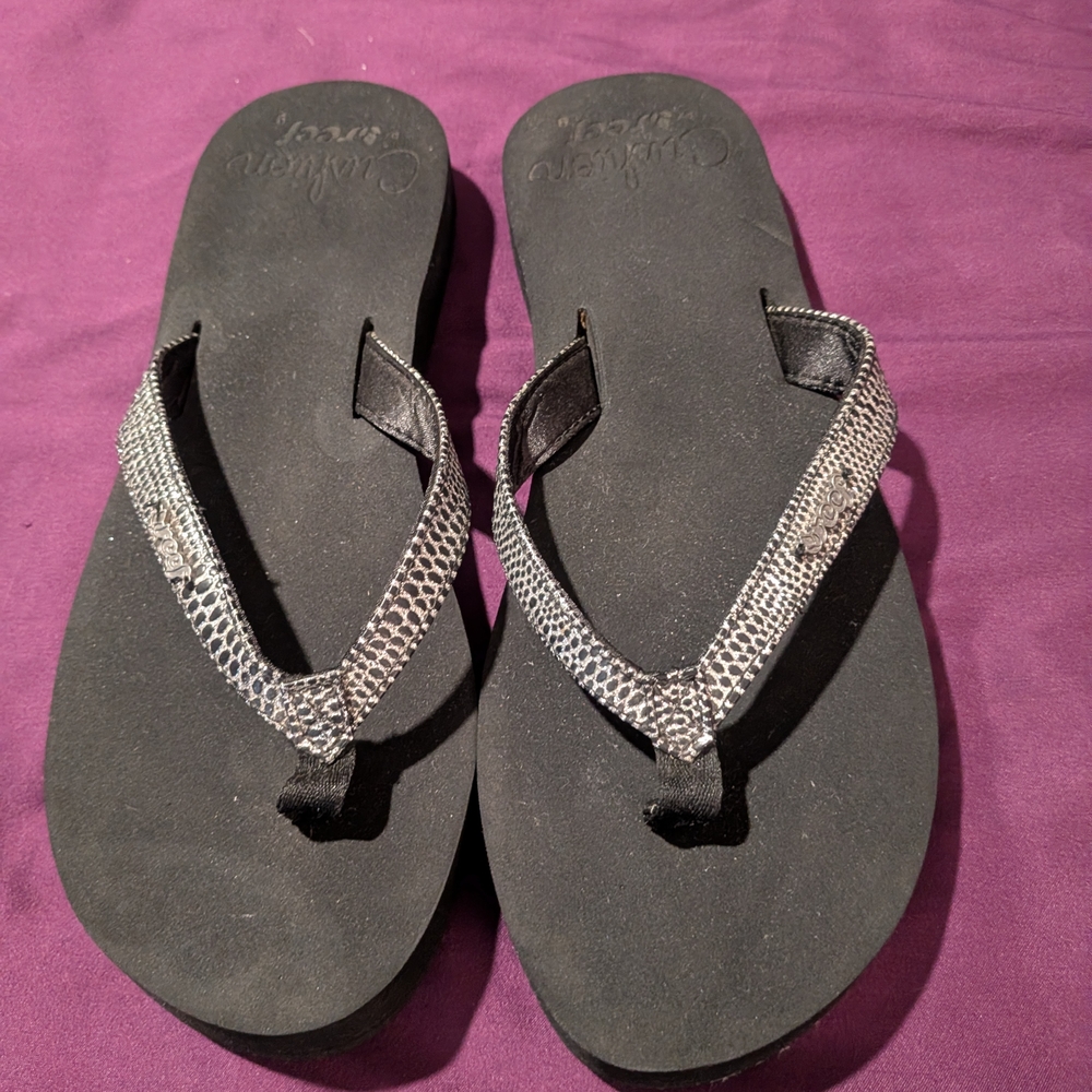 Reef Women’s Black Sandals with Silver Snake-Print Straps